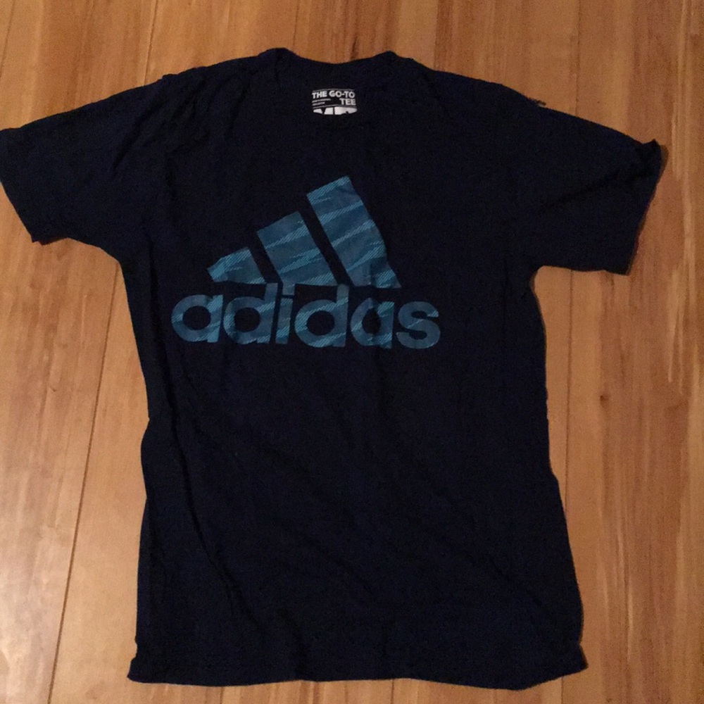 100% cotton and is a medium short sleeve shirt